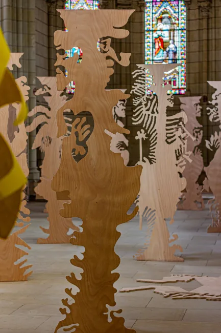 View of the exhibition futur anterieur at Chapelle Jeanne d'Arc made of an ensemble of plywood figurative sculptures