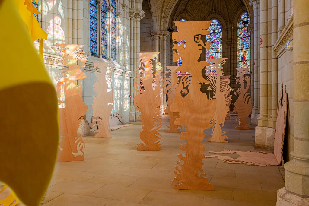 View of the exhibition futur anterieur at Chapelle Jeanne d'Arc made of an ensemble of plywood figurative sculptures