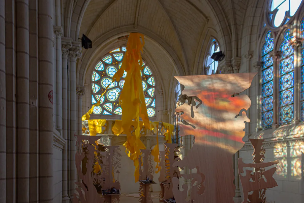 View of the exhibition futur anterieur at Chapelle Jeanne d'Arc made of an ensemble of plywood figurative sculptures