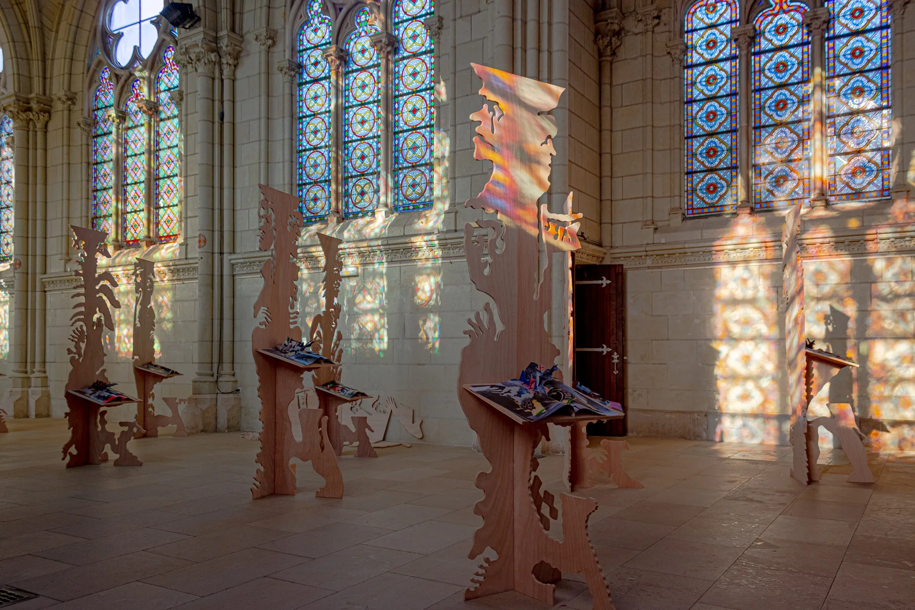 View of the exhibition futur anterieur at Chapelle Jeanne d'Arc made of an ensemble of plywood figurative sculptures