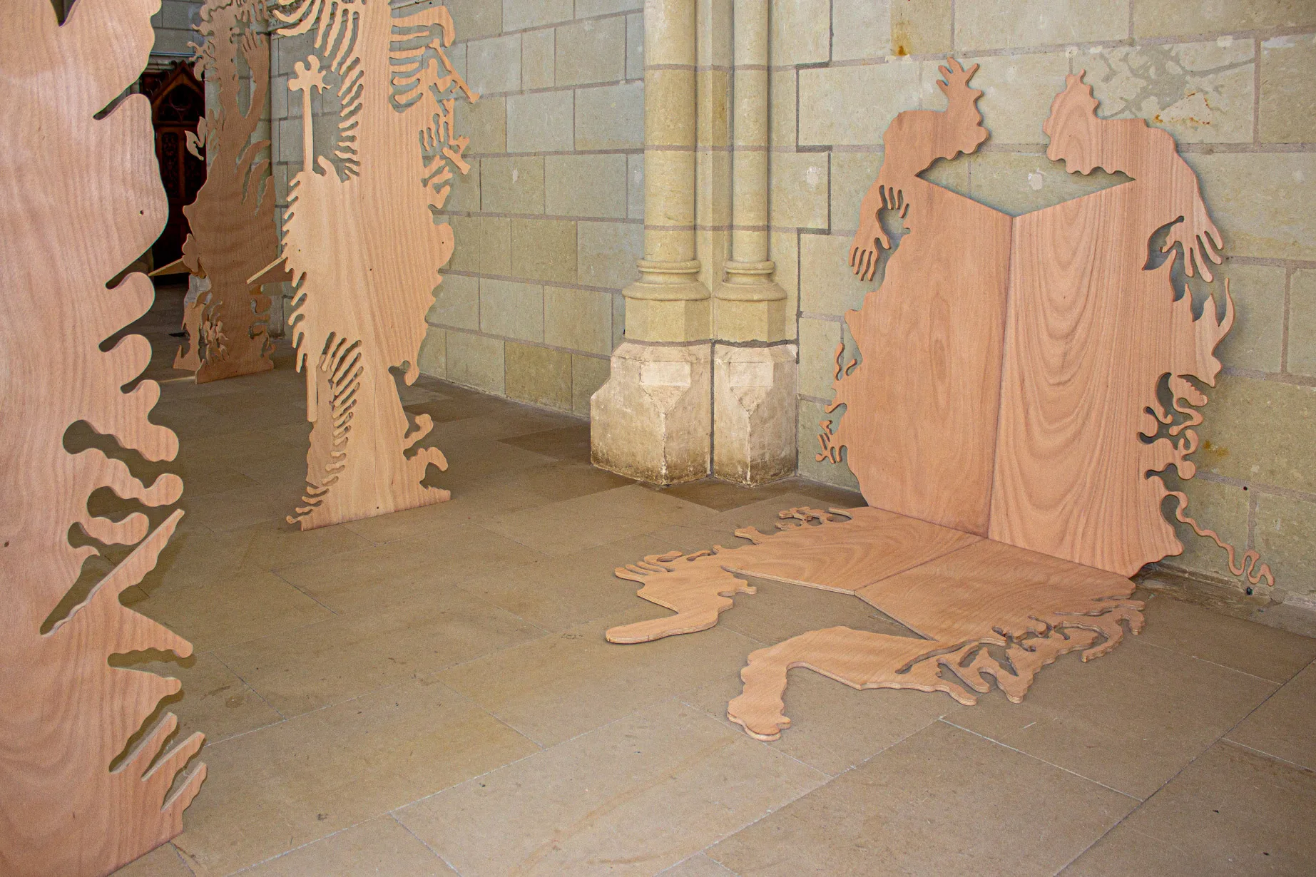 View of the exhibition futur anterieur at Chapelle Jeanne d'Arc made of an ensemble of plywood figurative sculptures